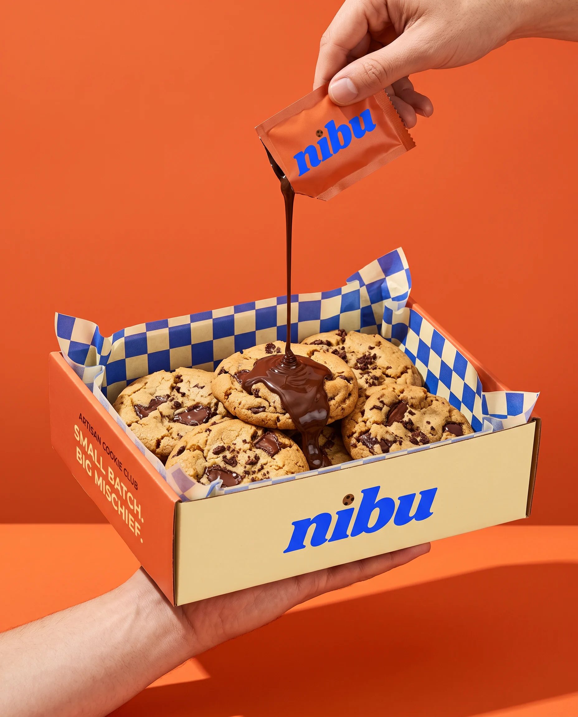 Chocolate pouring over NIBU cookies